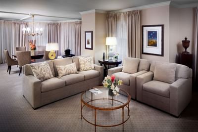 Couches & a dining table in Presidential Suite, Townsend Hotel