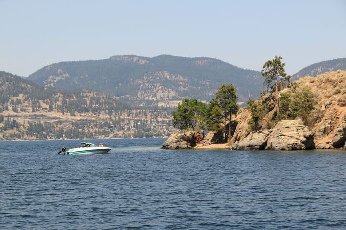 Boating at Okanagan lake near Outback Lakeside Vacation Homes