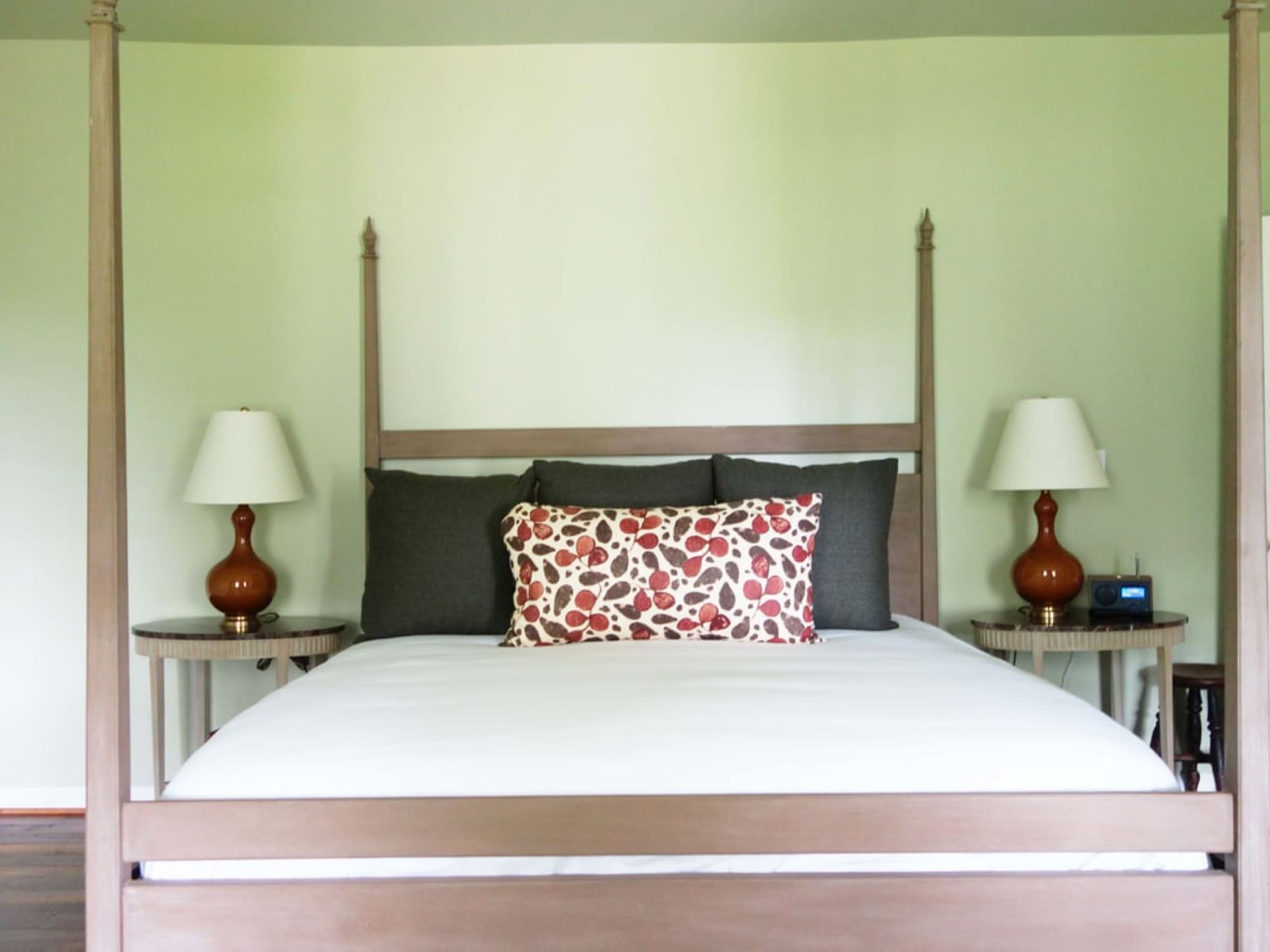 Four-poster bed with nightstands and lamps in the Thomas Mann Randolph room at The Clifton in Charlottesville.