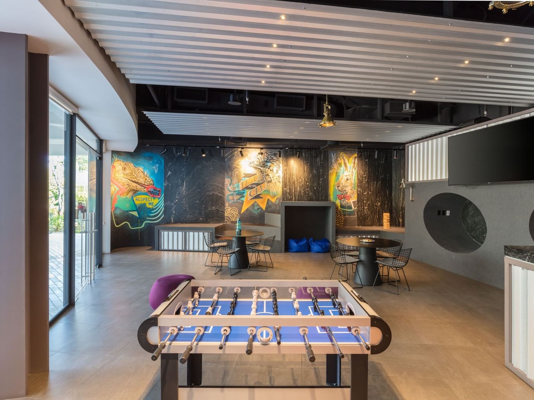 Foosball table & seating area, Teens Club at The Club at Solaz