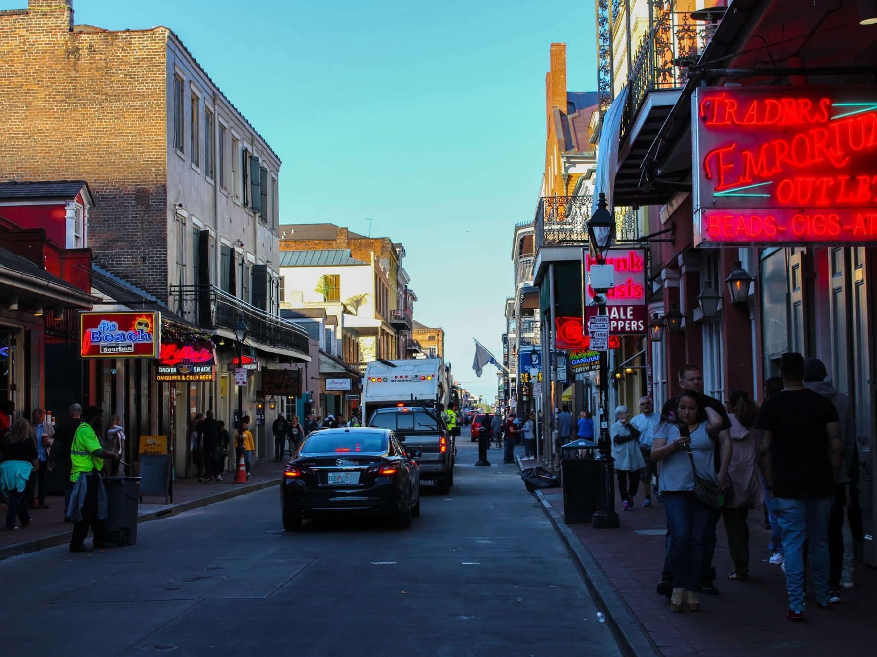 Cars & people on Bourbon Street near La Galerie Hotel