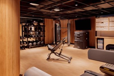 Well-equipped fitness center featuring various exercise equipment at Godfrey Hotel Detroit