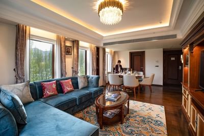 Spacious sofa in the living room with wooden floors in Grande Suite at The Indus Valley Leh, Ladakh Rooms