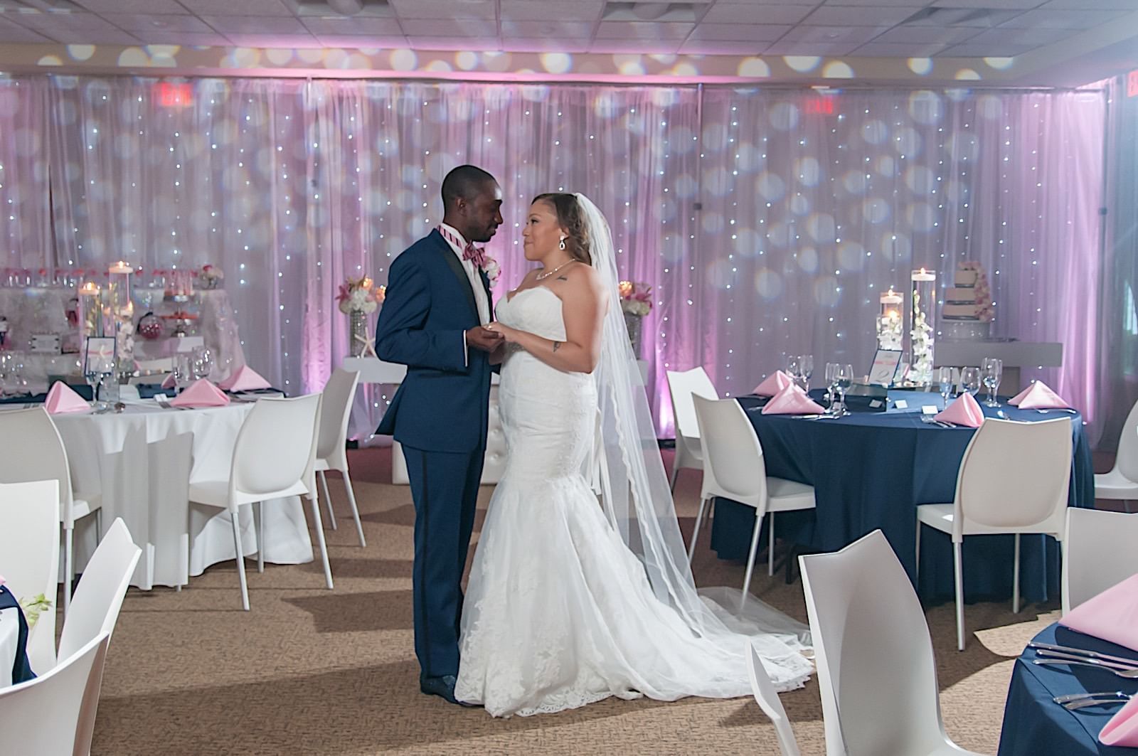 Newlyweds standing at a reception at Copamarina Weddings