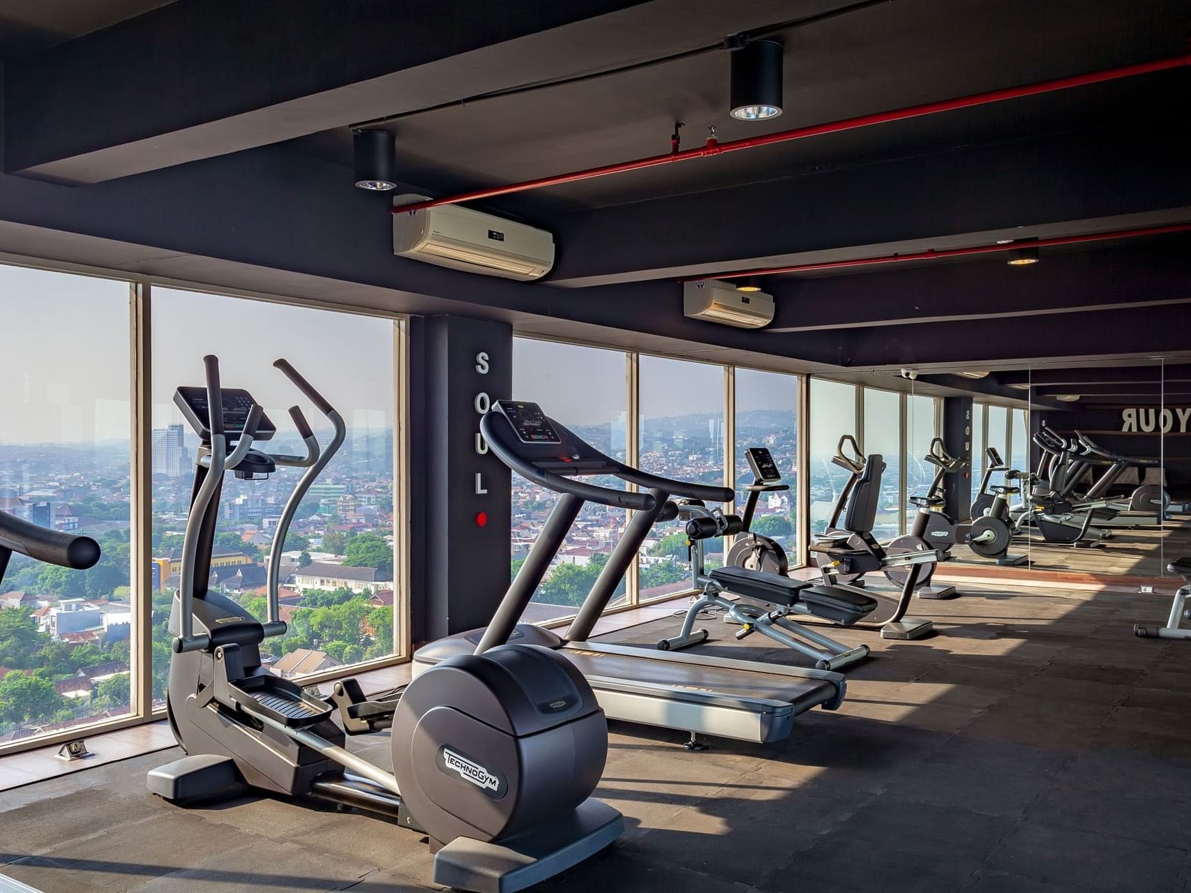 Exercise machines arranged in the fitness center at LK Hotel Simpang Lima