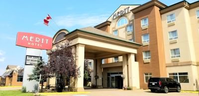 Exterior of Fort McMurray Hotels with parking area
