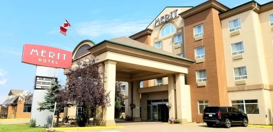 Exterior of Fort McMurray Hotels with parking area