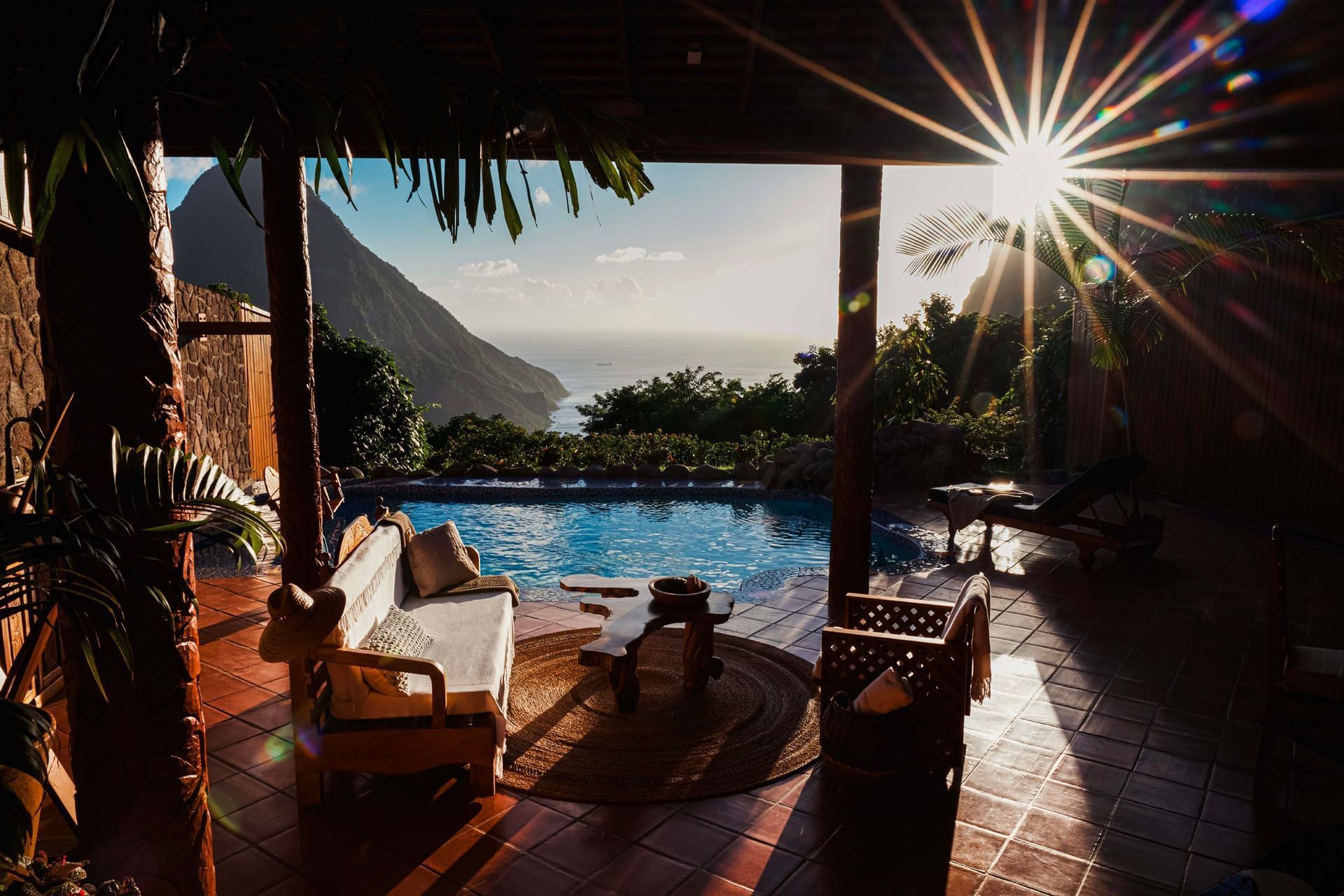 Cozy lounger arranged by the outdoor pool in Villa at Paradise Ridge at St Lucia Resorts