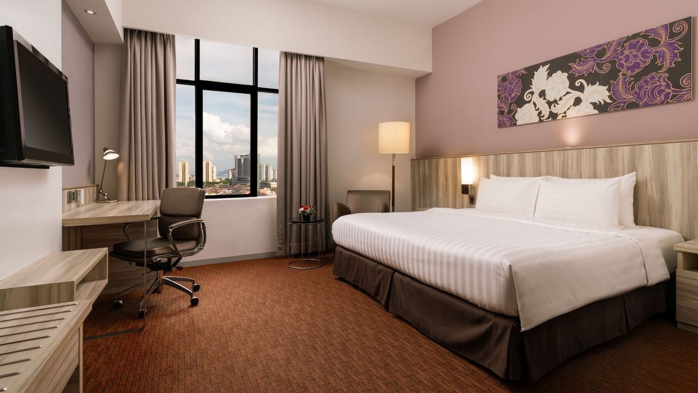 Workspace facing the bed in Superior King Room with city view and modern furnishings at Sunway Hotel Georgetown