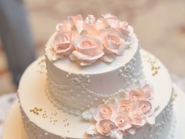 Close-up of a decorated wedding cake at Warwick Melrose Dallas