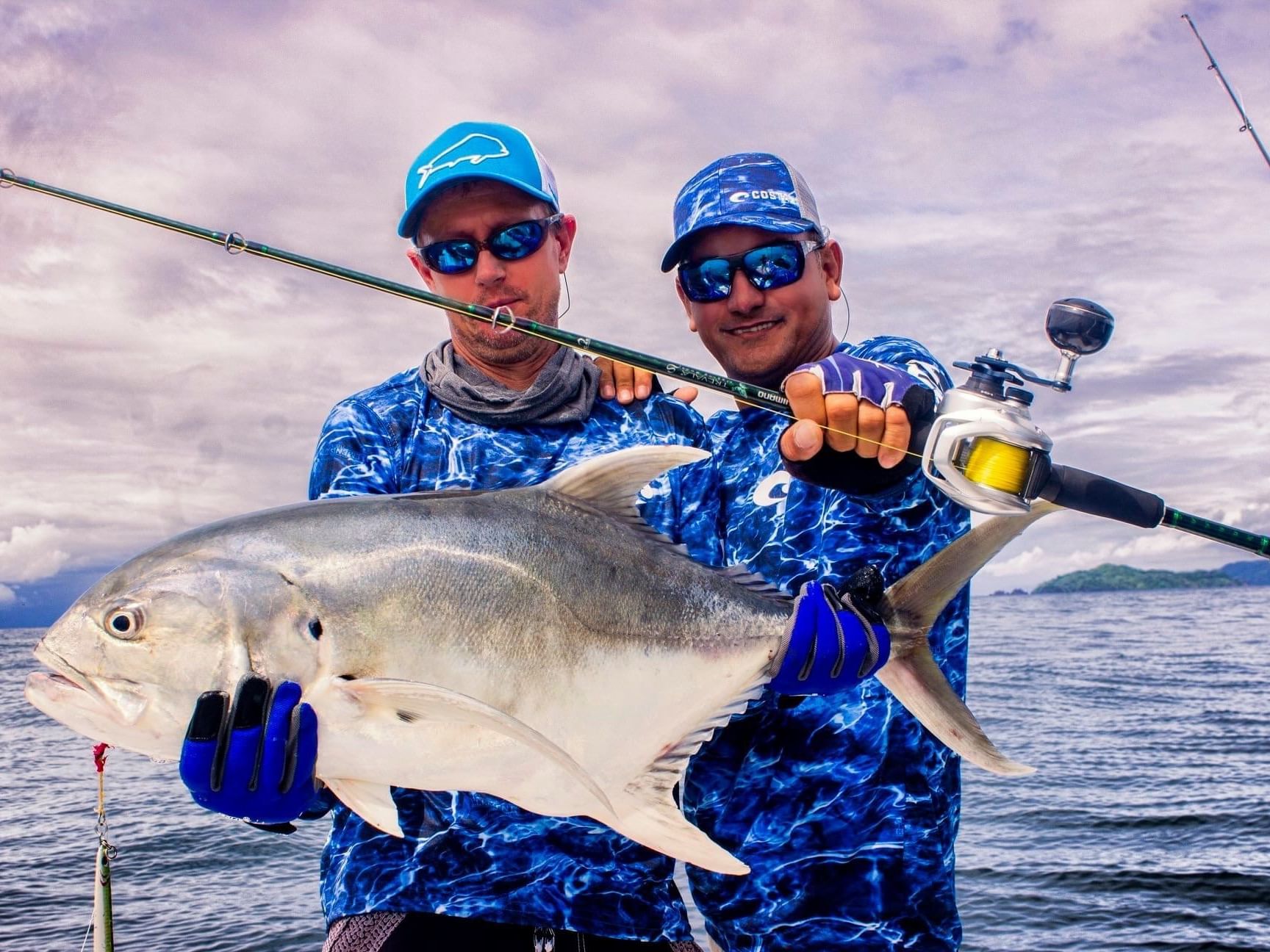 Two men holding a large fish they caught near Los Altos Resort