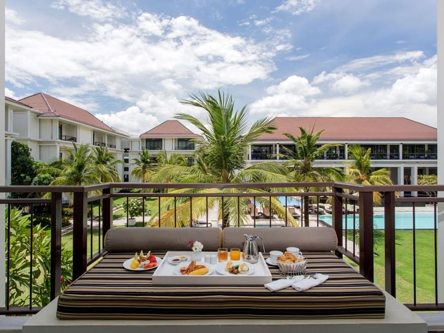 High tea served in terrace with pool view at U Hotels