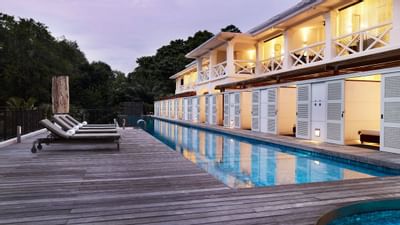 Pool area by the rooms with loungers at Amara Sanctuary Resort