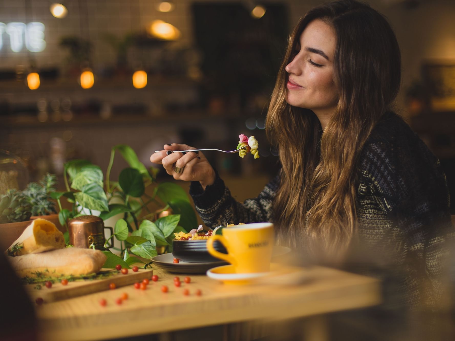 Closeup of a girl enjoying her meal at Originals Hotels