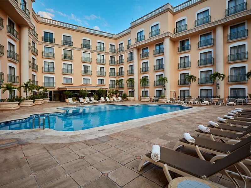 Outdoor swimming pool with pool beds at Fiesta Americana