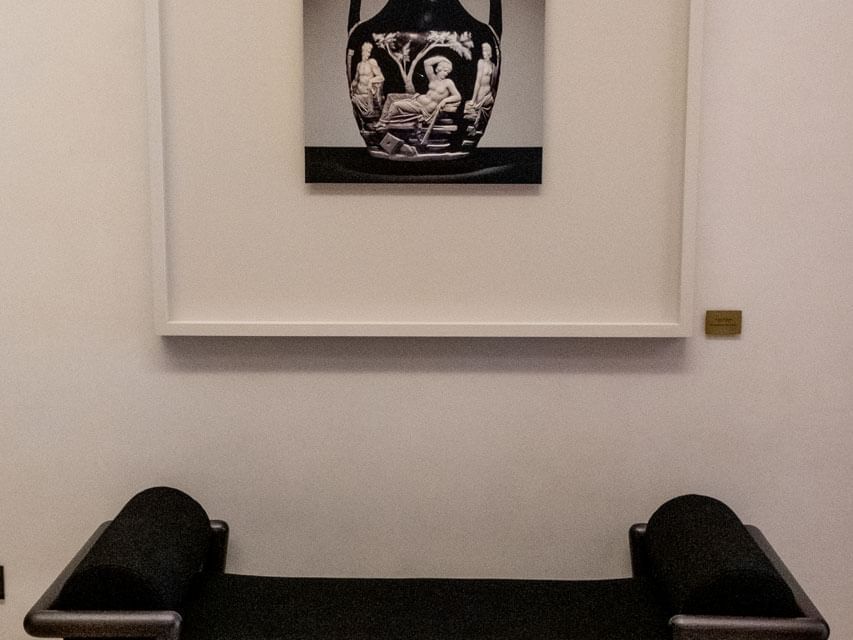 Black and white artwork above a couch in the lobby area at Margutta 19