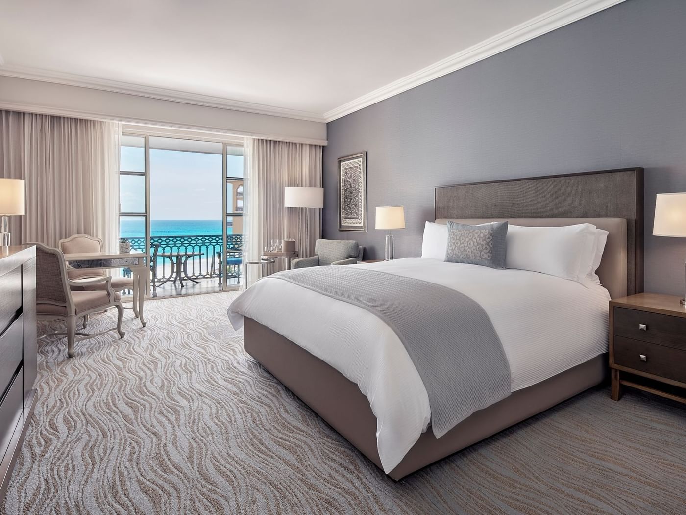 Workspace facing the bed in Club Seafront King Room with balcony at Kempinski Hotel Cancún