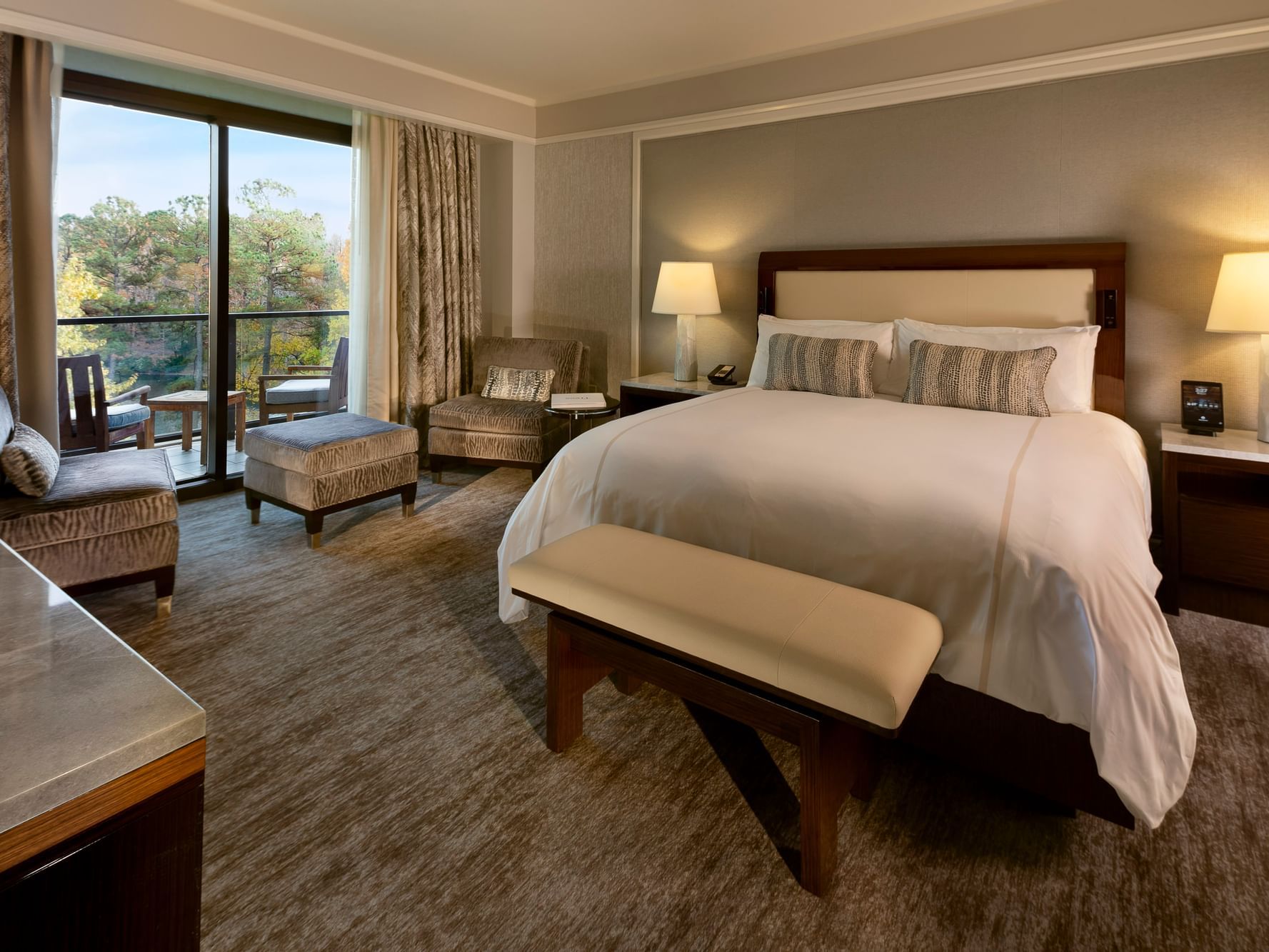 Interior of Executive Lake View Balcony Suite, overlooking the pristine lake at The Umstead Hotel and Spa