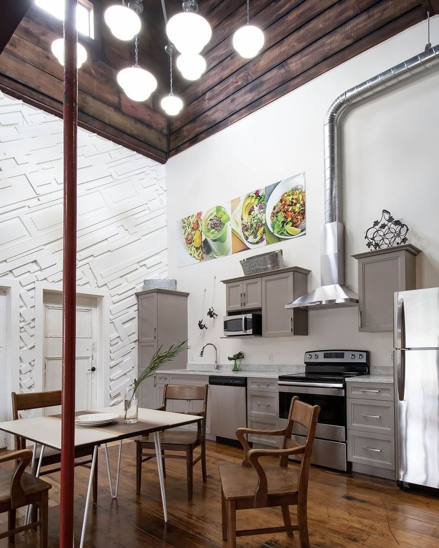 Kitchen Interior of Executive Residences with stove & other appliances at Retro Suites Hotel