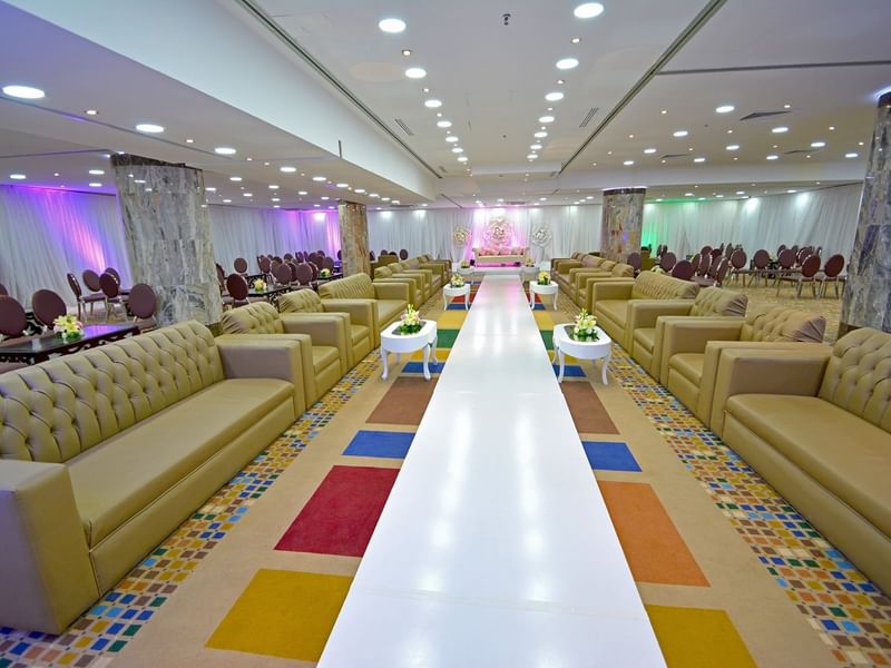 Event arrangement with large sofas in Hall 1 at Dabab Hotel by Warwick - Riyadh