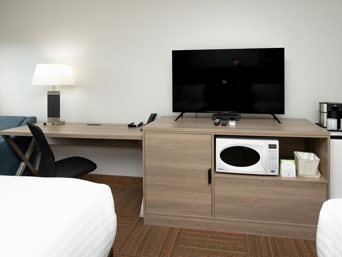 Coast Two Queens room with two beds, desk, TV, microwave and mini-fridge.