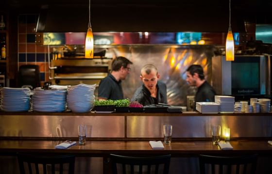 Waiters working in a restaurant at Paradox Hotels