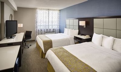 Twin beds in Double Queen City View Room at Waterfront Hotel
