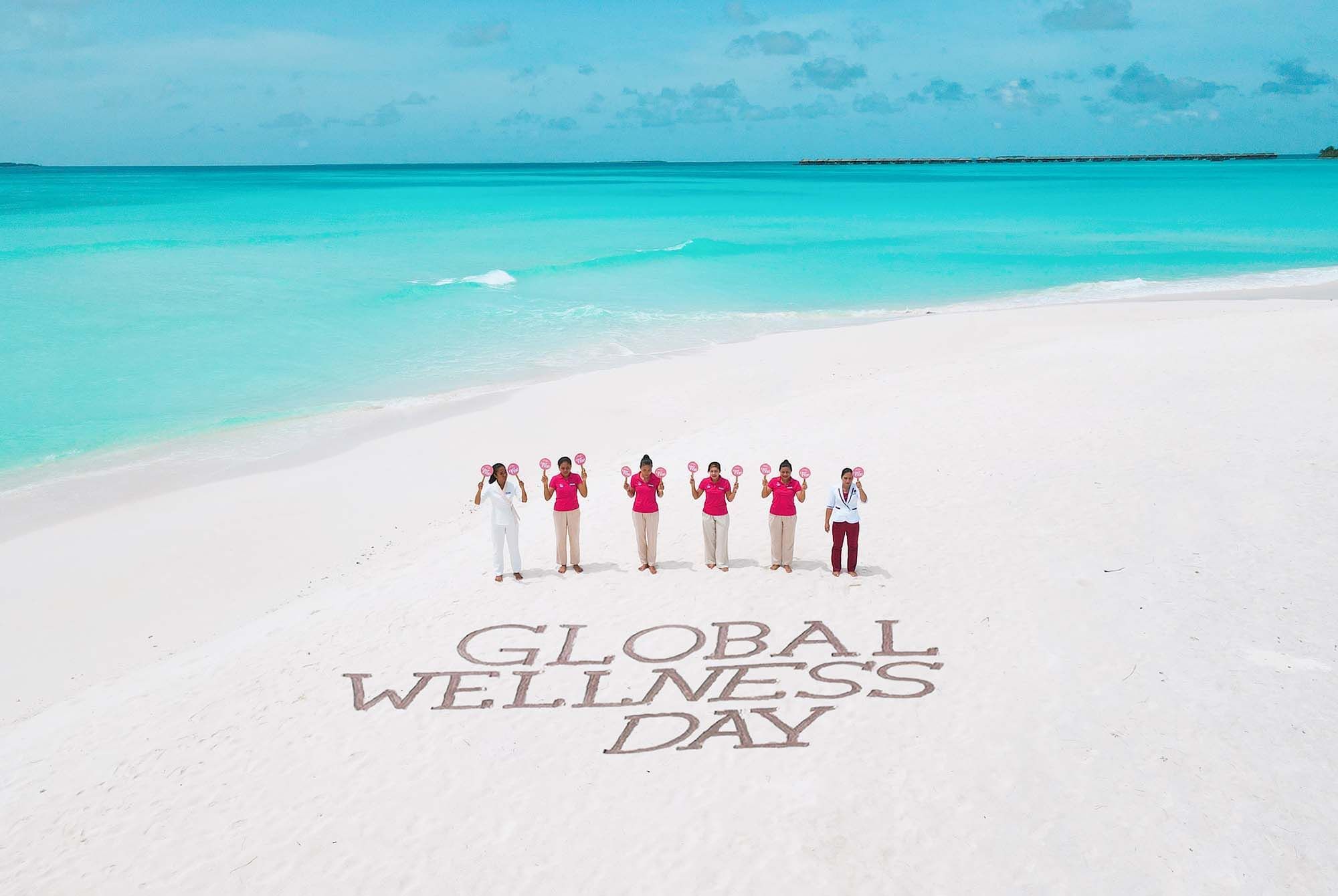 The Signature Collection staff posing for Global Wellness Day