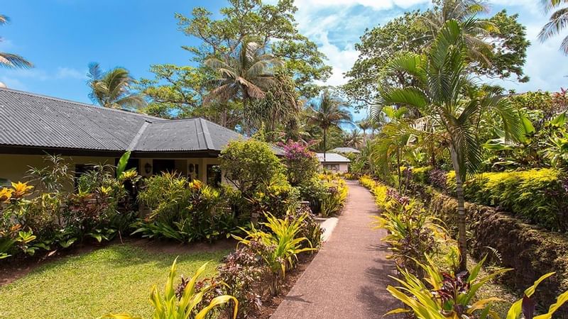 A garden path in Erakor Residence at Warwick Le Lagon