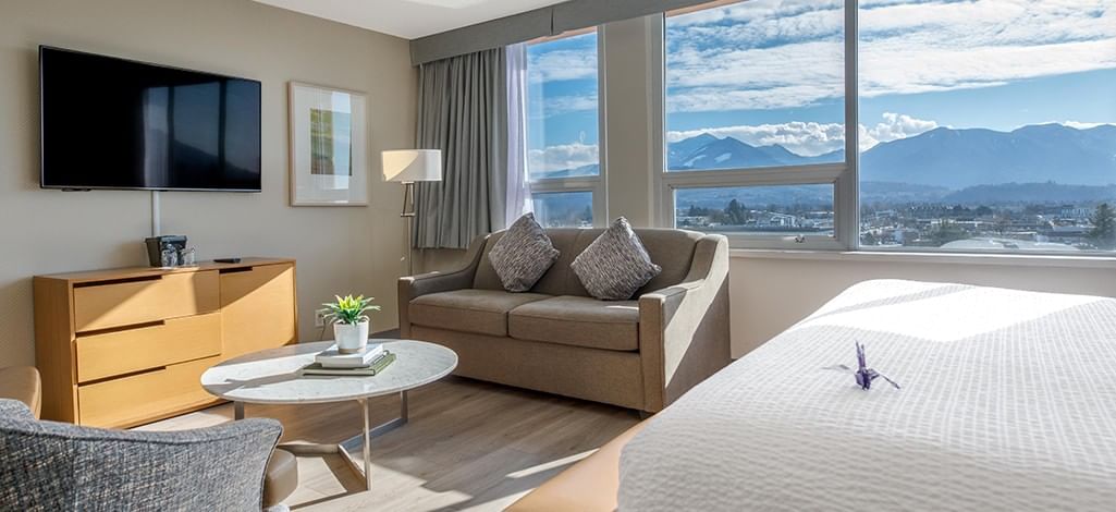 Chilliwack hotel guest room with sitting area and view