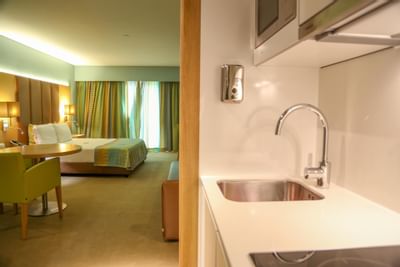 Kitchen area by the bedroom in Deluxe Room at Hotel Presidente Luanda