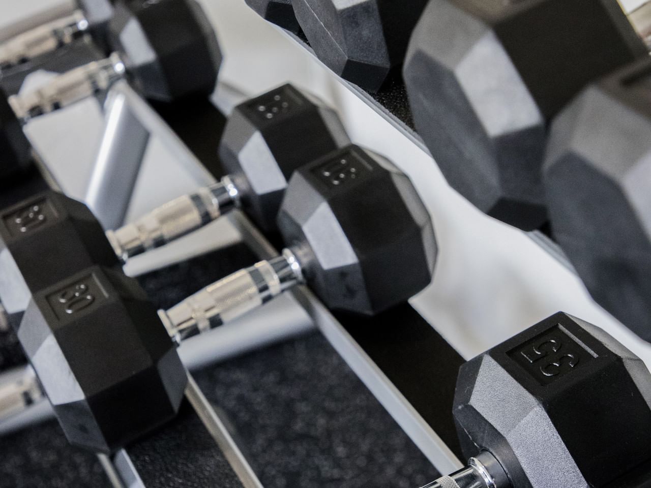 Close-up of weights on a Gym rack at Gamma Hotels