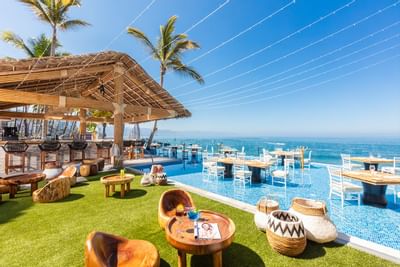 Outdoor dining area with at Playa Los Arcos