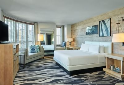 Interior of Prestige Corner Executive Suite with carpeted floors at Hotel Republic San Diego