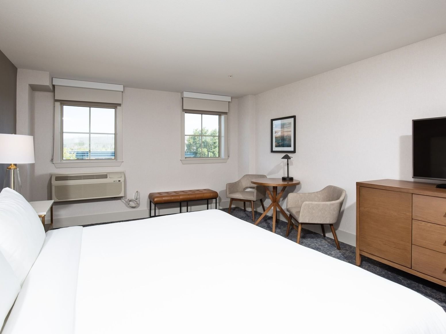 a bed facing a tv in a hotel room