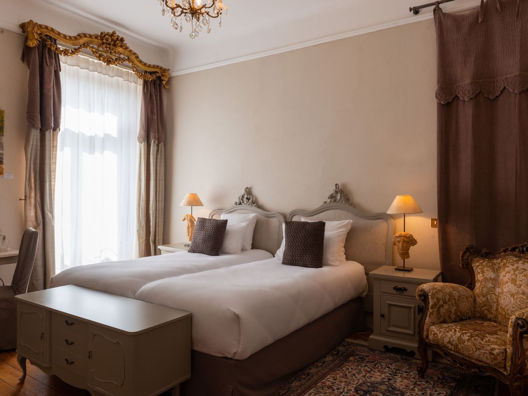 Family Suite bedroom with twin beds at The Originals Hotels