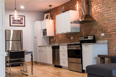 Interior of the kitchen in Executive Residence at Retro Hotel