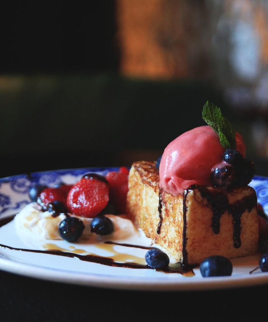 Dessert with fresh berries served in Louise Taverne & Wine bar at Hotel Port Royal