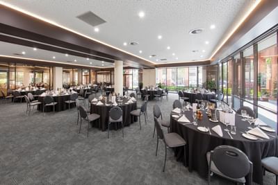 Banquet black themed tables arranged at Amora Hotel Melbourne