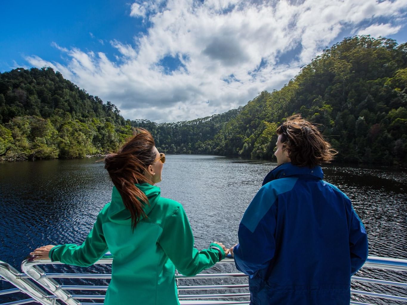 Couple enjoying the mountain view from Gordon River Cruise