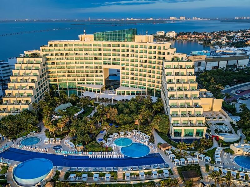 Aerial view of Live Aqua Cancun Main Pool with outdoor pools and ocean view