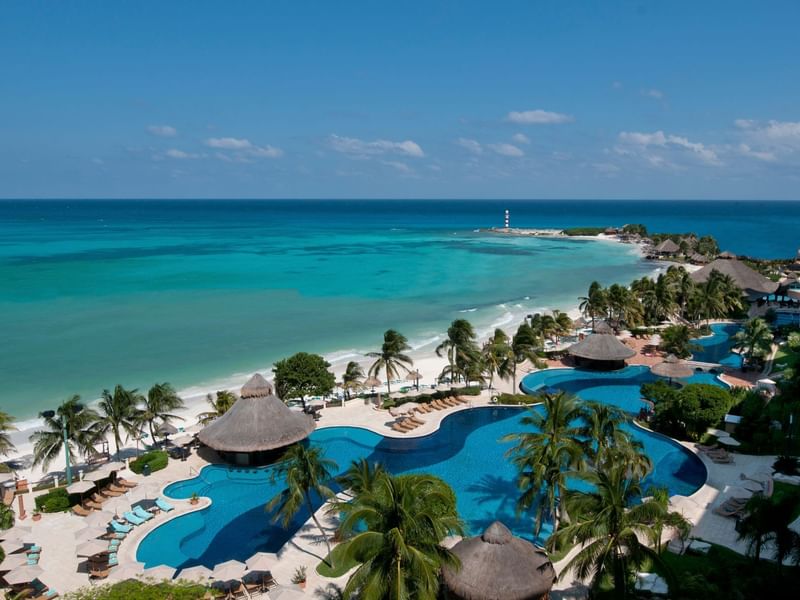Outdoor hotel pool & ocean aerial view at La Colección Resorts