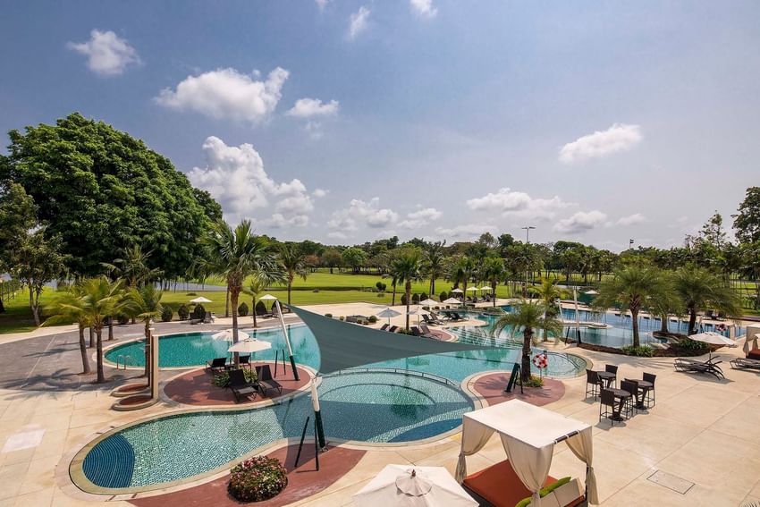 Pool area with a breathtaking view of the golf course Eastin Hotels