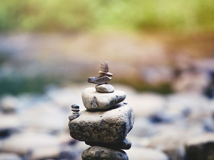 stones stacked up on top of each at Heritage House Resort lake