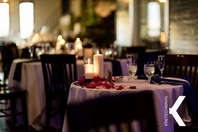 Tables set for a wedding with candles
