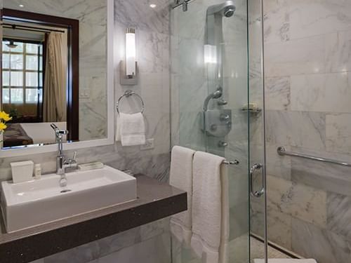Vanity & shower in a Junior Suite bathroom at Hotel El Convento