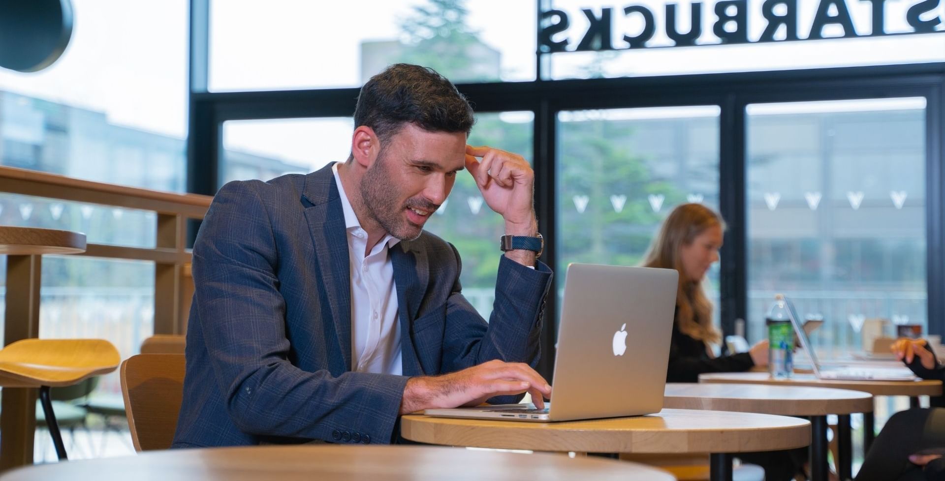 A businessman working on the laptop at Village Hotel Bury