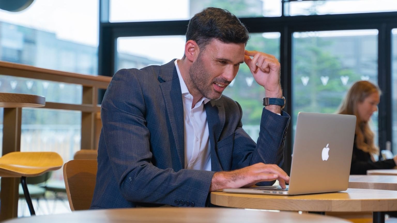A man looking into his laptop at Village Hotel Bournemouth