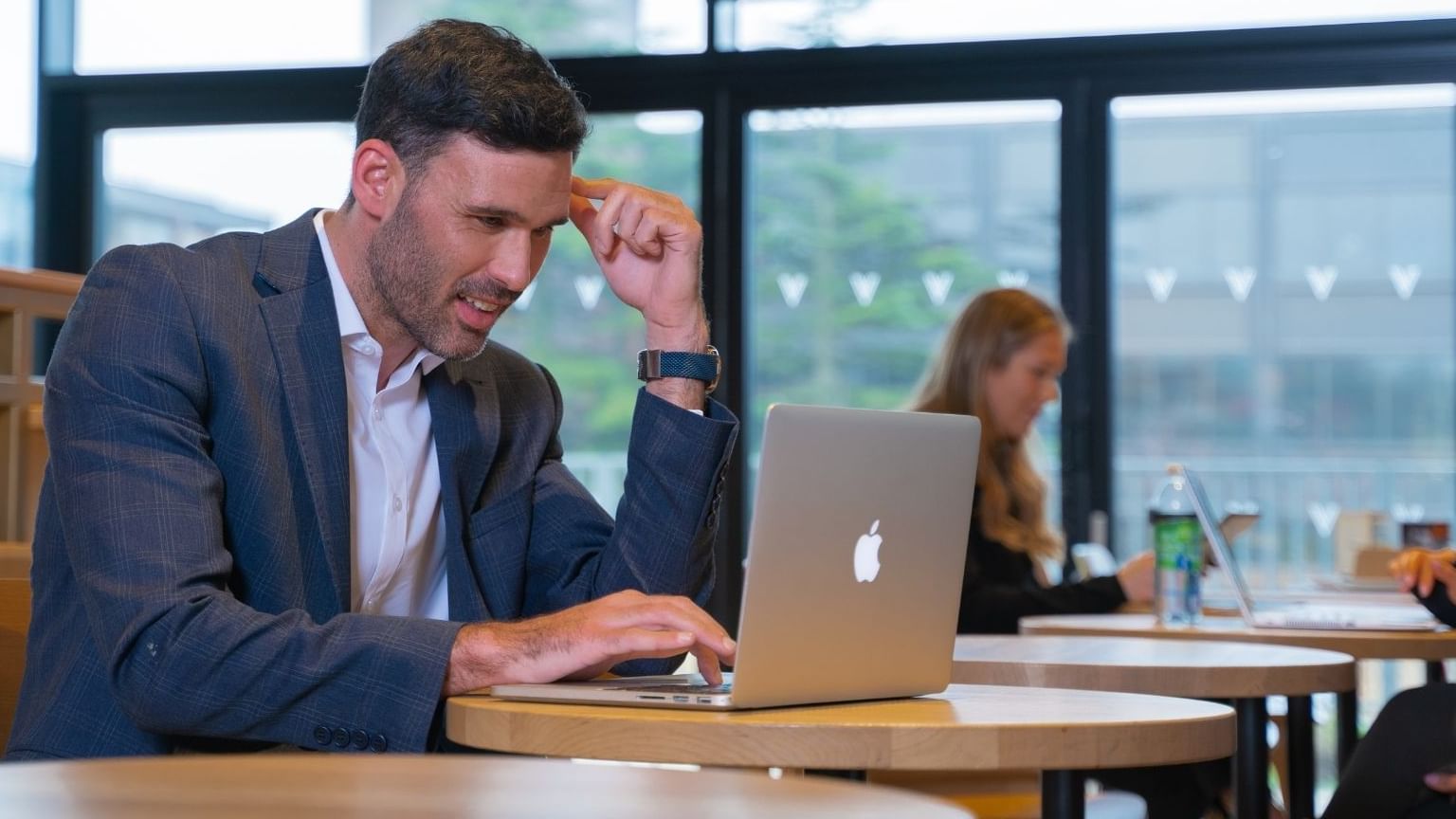 A man looking into his laptop at Village Hotel Birmingham