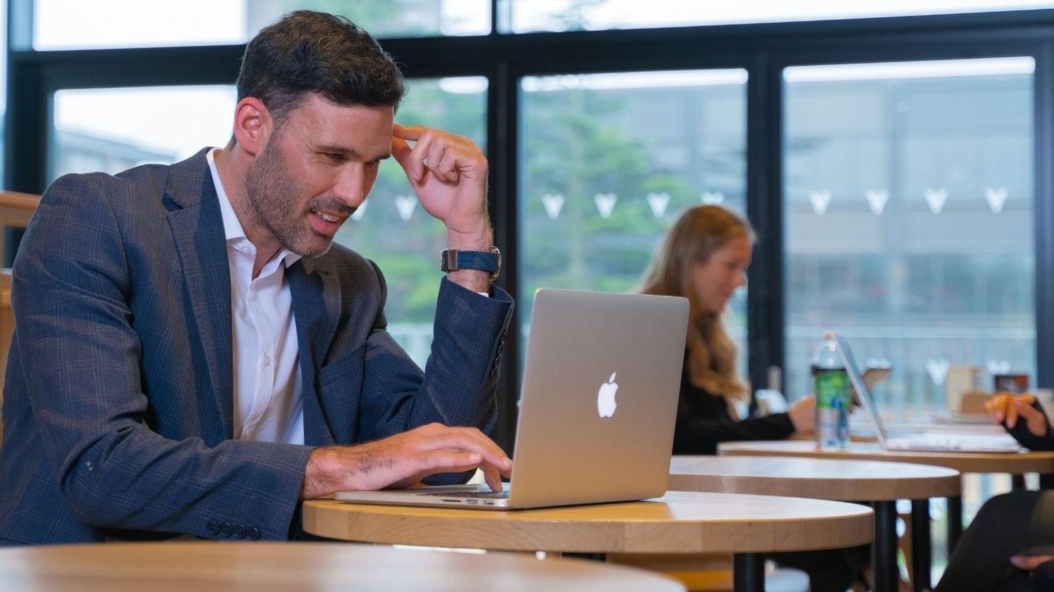 A man looking into his laptop at Village Hotel Birmingham